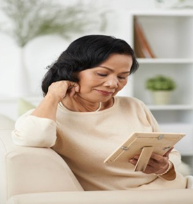 a woman looking at a photograph