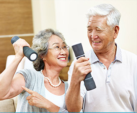 a senior couple lifting weights